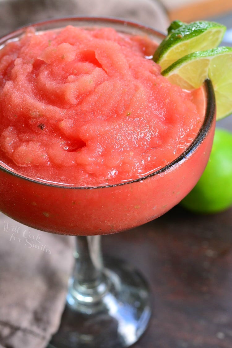 Watermelon Lime Frozen Margaritas with lime garnish in a glass