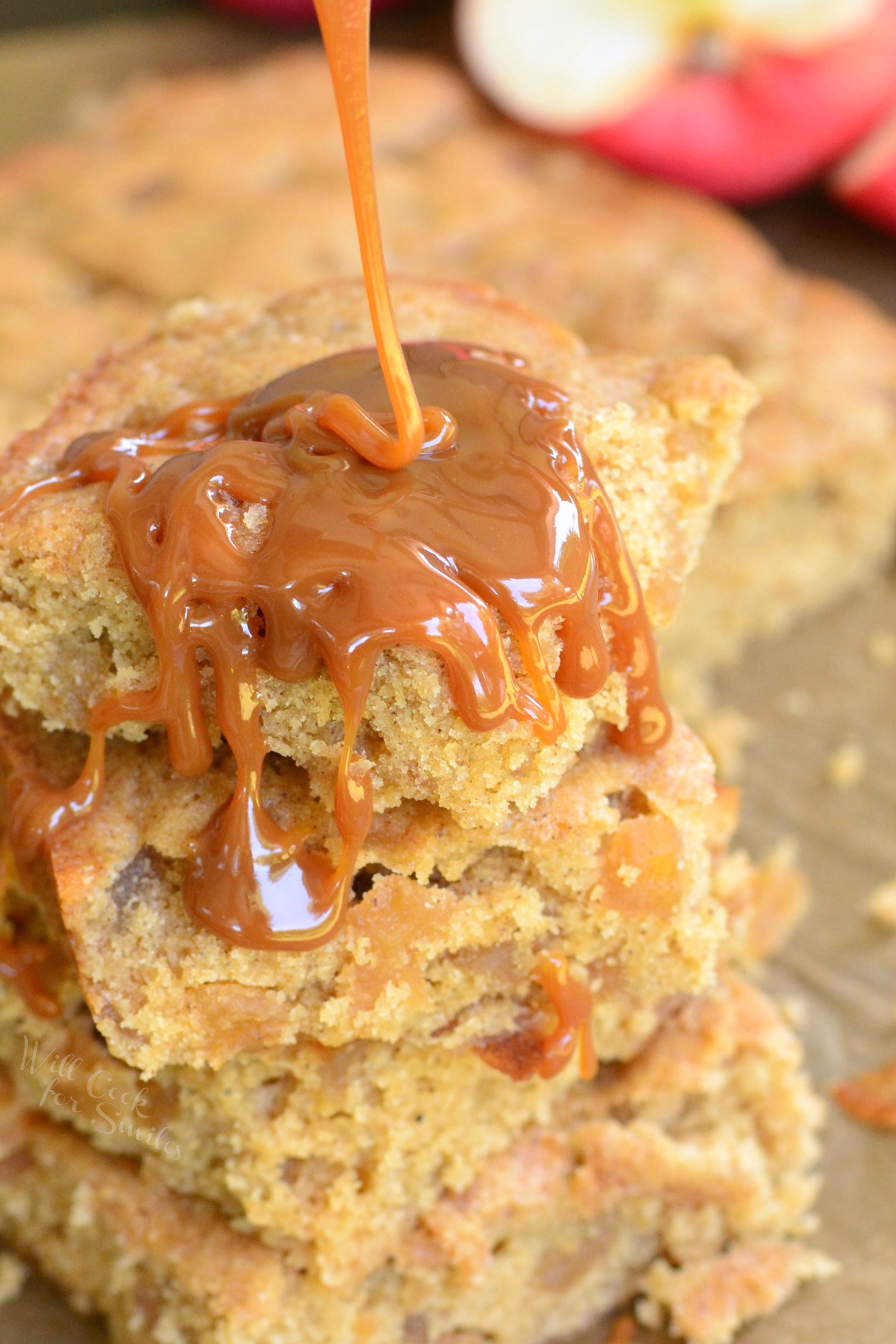 Apple Pie Blondies stacked up pouring caramel over top 