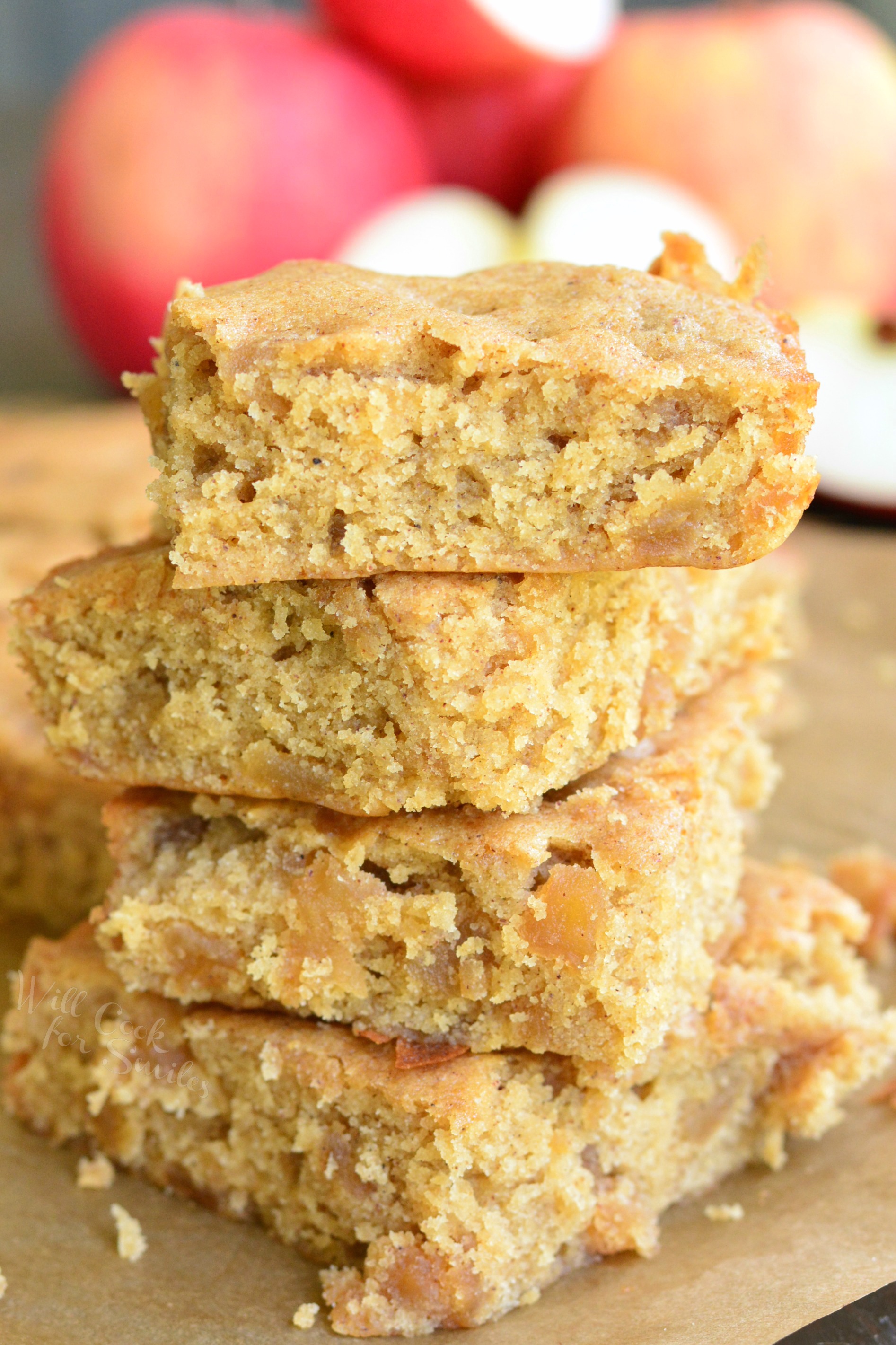 Apple Pie Blondies stacked up on parchment paper 