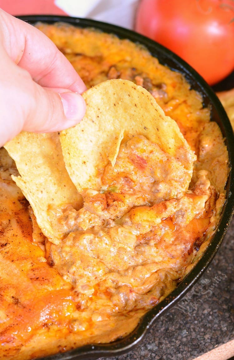 Creamy Beef Taco Dip with a chip in it 