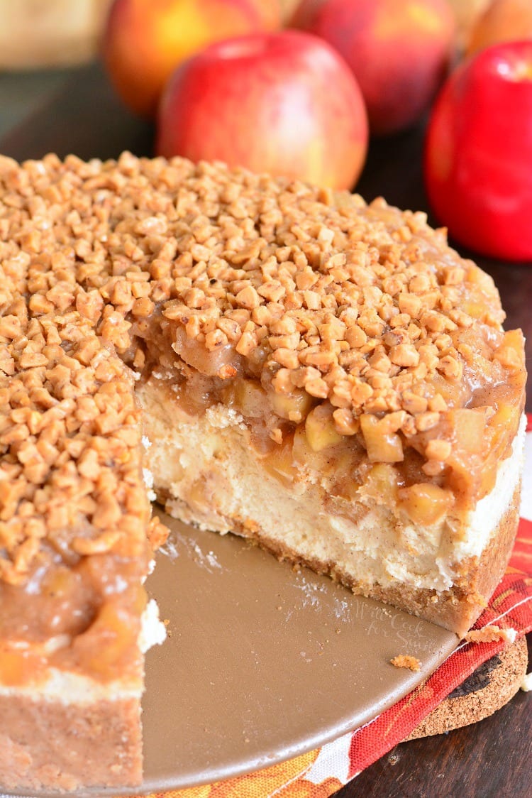 Apple Pie Cheesecake with a piece missing 