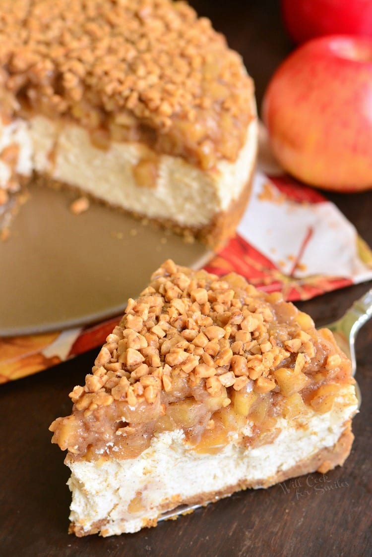 Apple Pie Cheesecake slice on a cutting board 