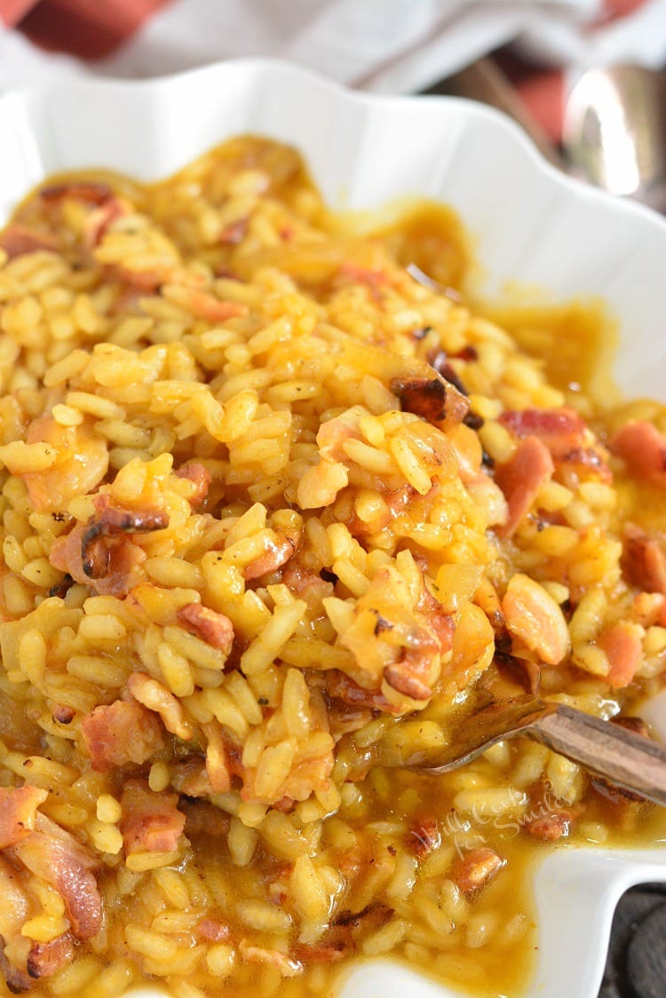 Bacon Onion and Pumpkin Risotto Recipe in a bowl with a spoon 