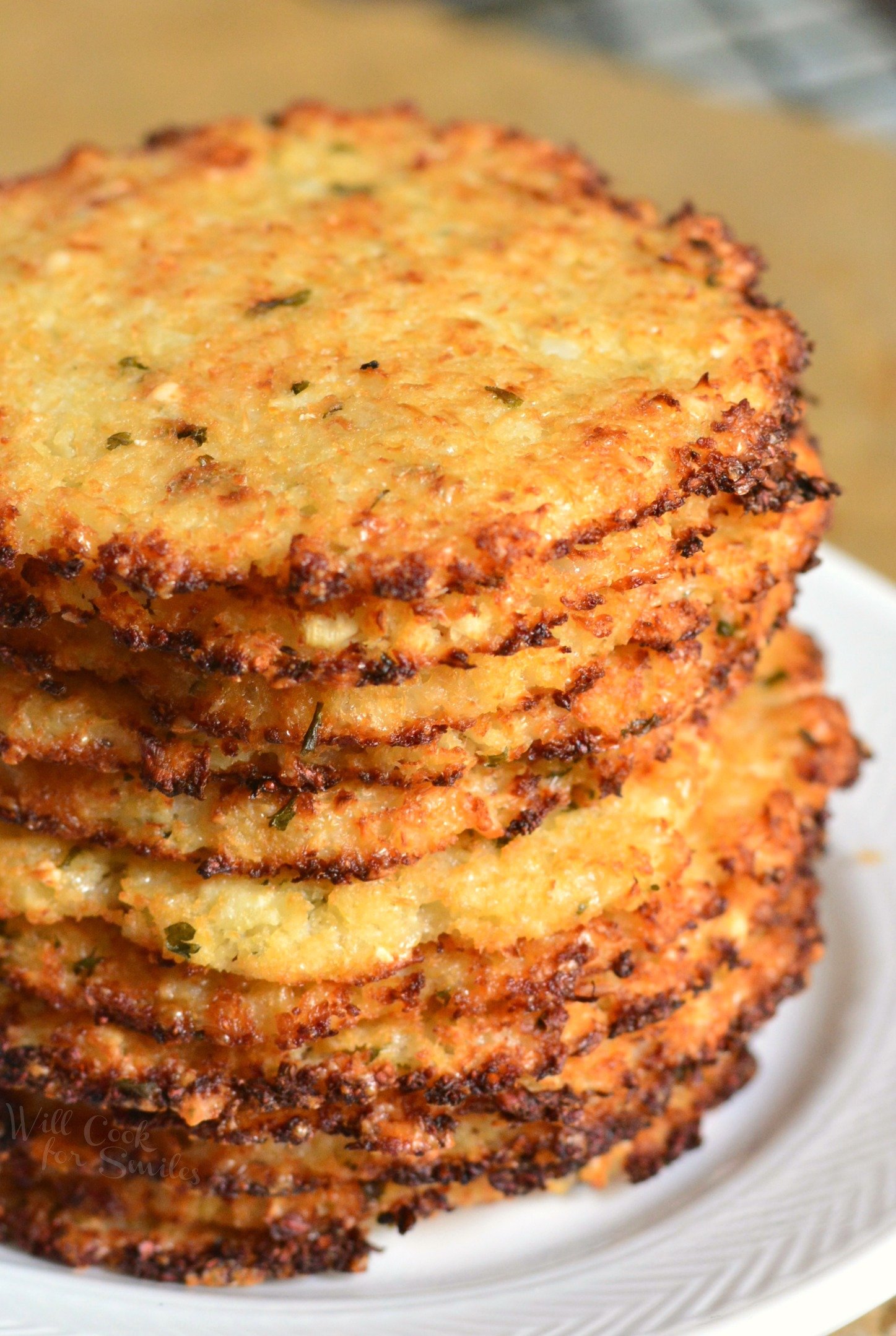 Cauliflower Parmesan Crisps. Amazing cauliflower snack that kids and adult will love. All you need is a head of cauliflower, block of Parmesan cheese, dry parsley flakes, and some garlic powder. #snack #cauliflower #parmesan 