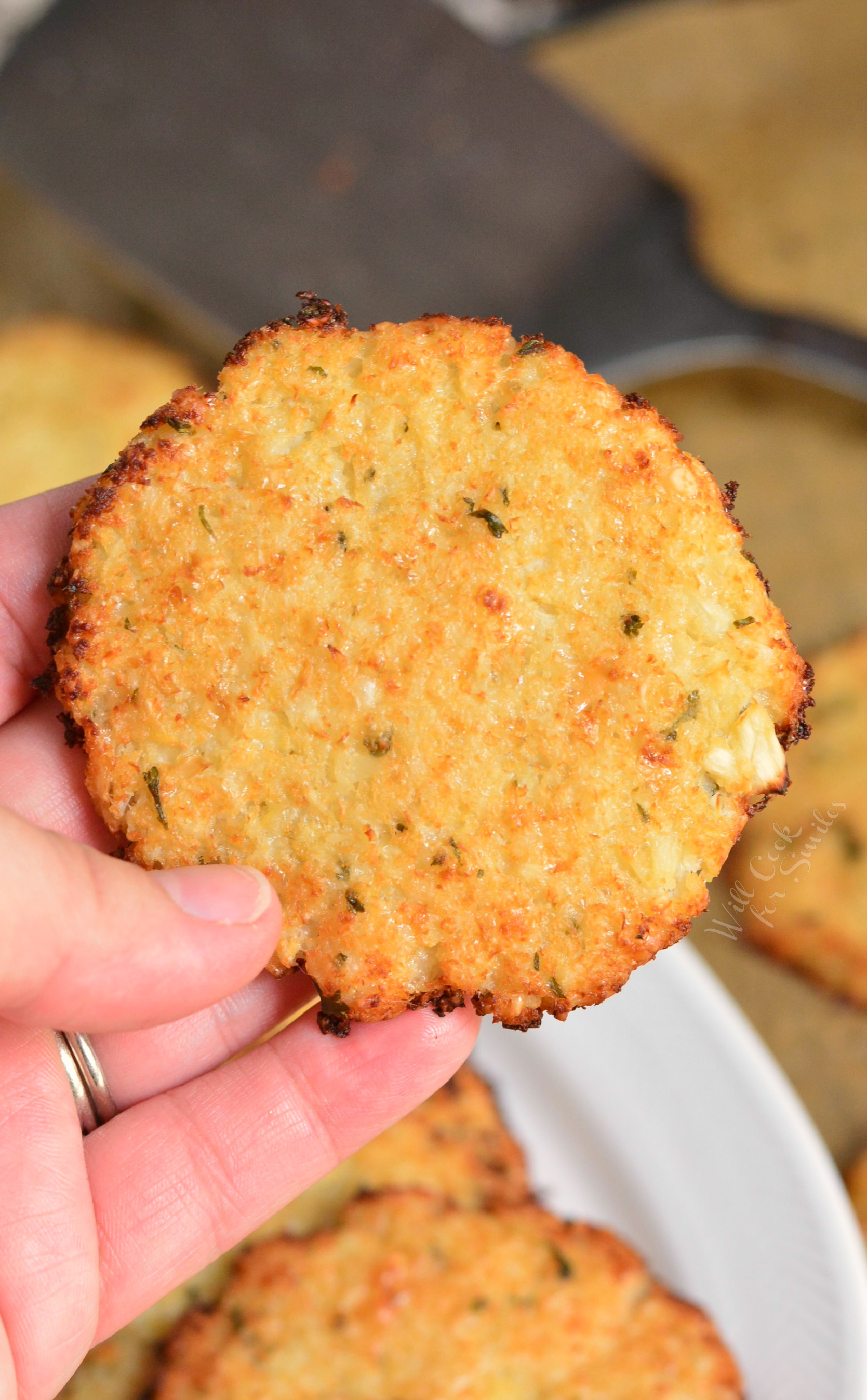 Cauliflower Parmesan Crisps. Amazing cauliflower snack that kids and adult will love. All you need is a head of cauliflower, block of Parmesan cheese, dry parsley flakes, and some garlic powder. #snack #cauliflower #parmesan 