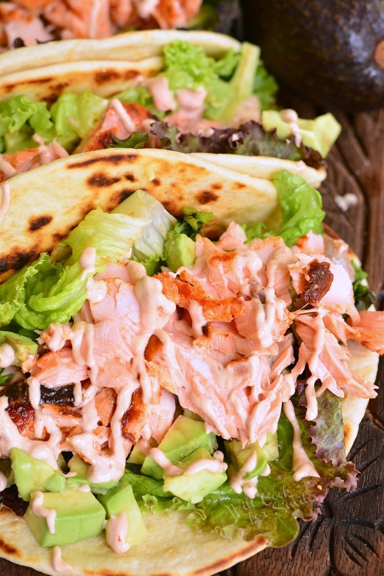 salmon tacos on a cutting board 