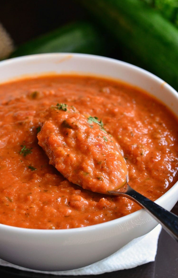 Zucchini Tomato Soup Recipe in a bowl with a spoon 
