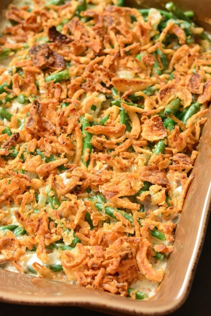 closeup of baked green bean casserole with fried onions.