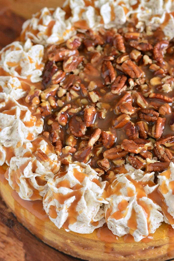 Pumpkin Cheesecake with Pecans and Caramel on a cutting board 