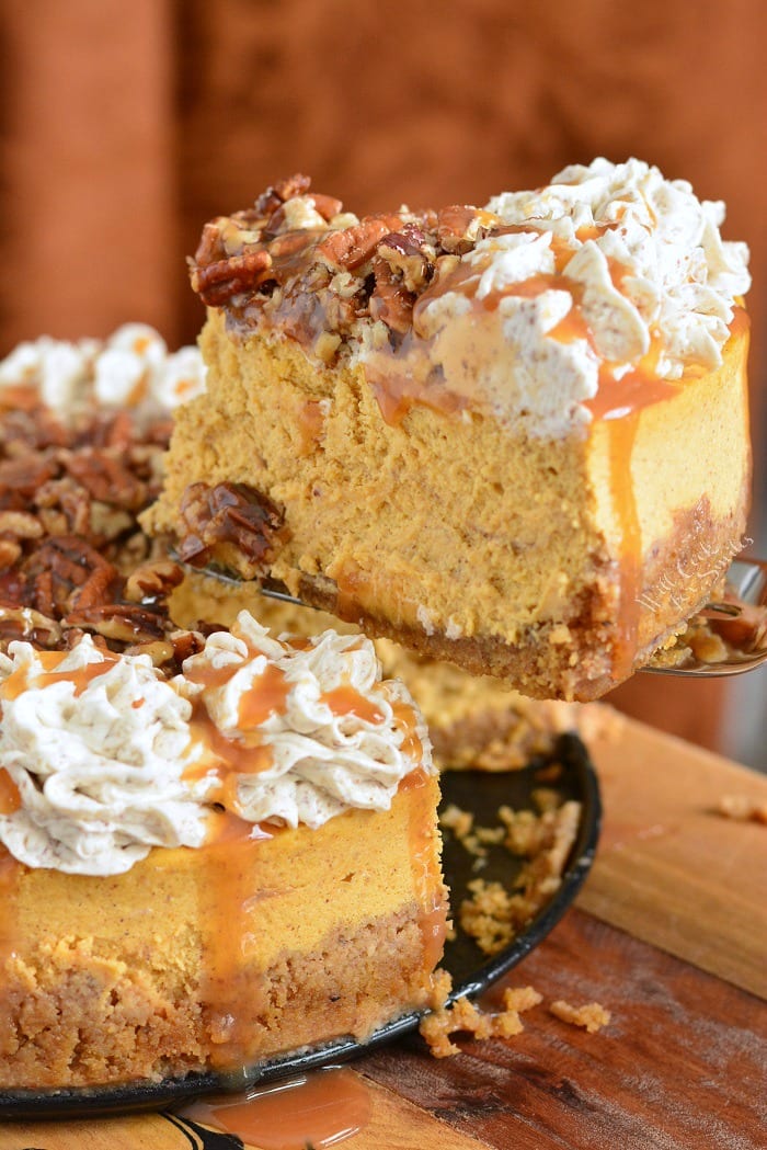 Caramel Pecan Pumpkin Cheesecake on a cutting board 