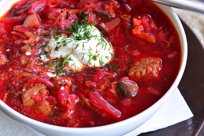 horizontal view of soup in the bowl with sour cream 