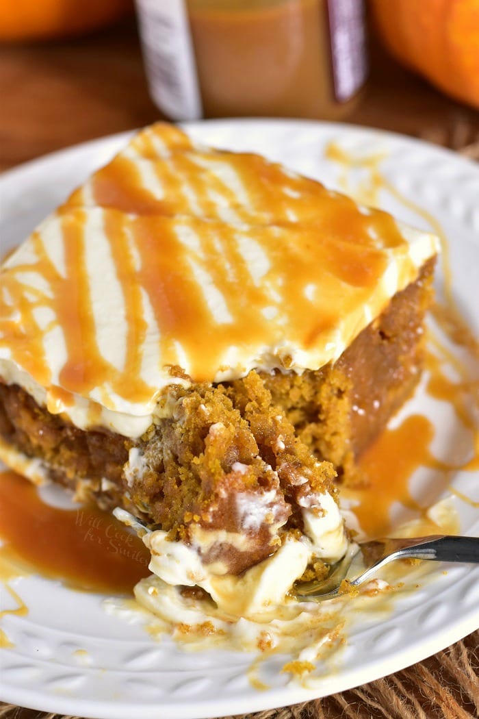 Pumpkin Cake with Salted Caramel and Cream Cheese Frosting. Soft, moist pumpkin cake soaked with salted caramel and topped with smooth cream cheese frosting. This pumpkin cake is paired beautifully with salted caramel flavors and creamy frosting in each bite. #cake #Pumpkin #pumpkincake #caramelcake #saltedcaramel