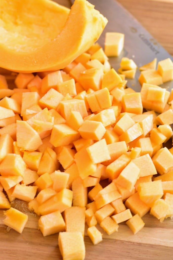 How to cut pumpkin. Peel and dice pumpkin meat on a wood cutting board 