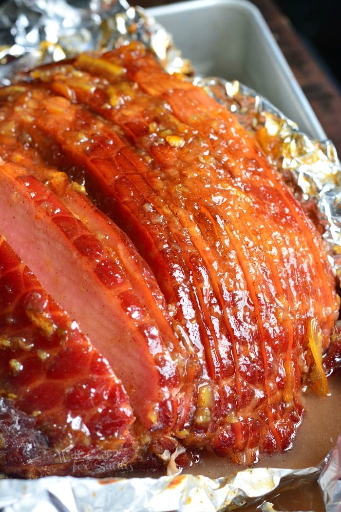 Orange Honey Glazed Baked Ham in a baking dish 