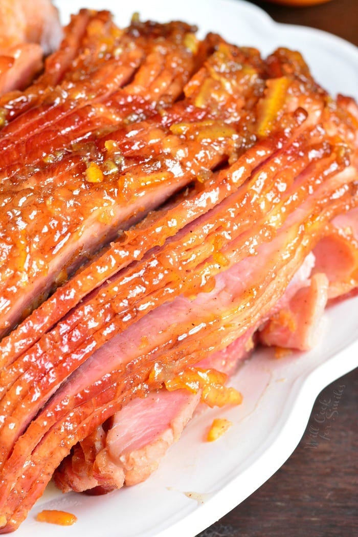Baked Ham with Orange Honey Ham Glaze on a serving platter 