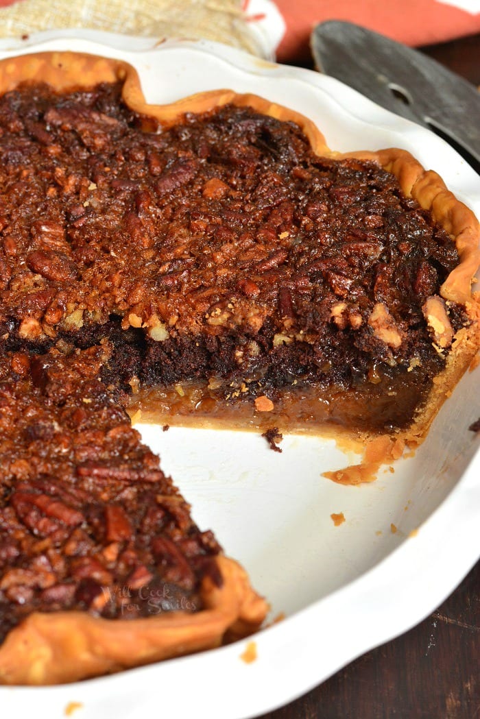 Brownie Pecan Pie with slice missing in pie pan 