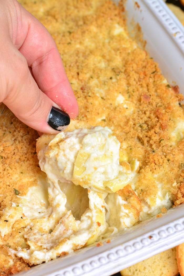 Creamy Crab and Artichoke Dip in a baking dish 