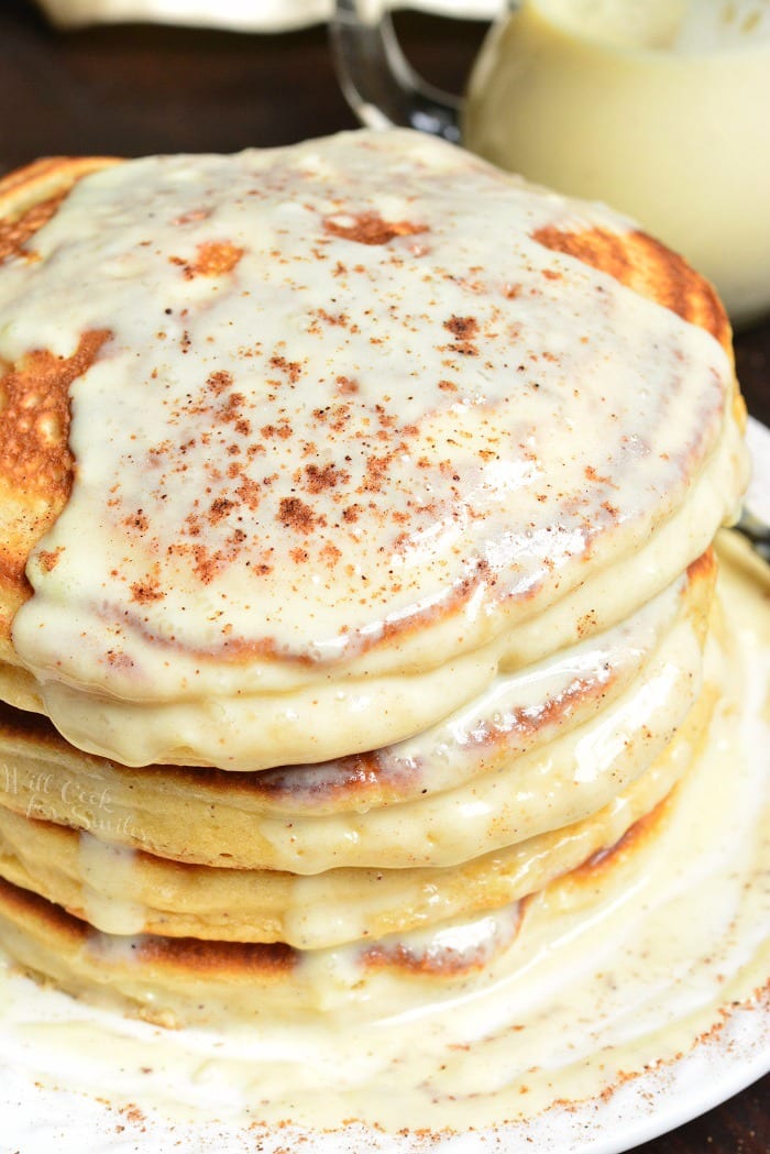 Eggnog Pancakes staked on a plate with eggnog sauce 