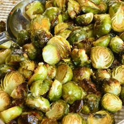 gathered roasted brussels sprouts on baking sheet.