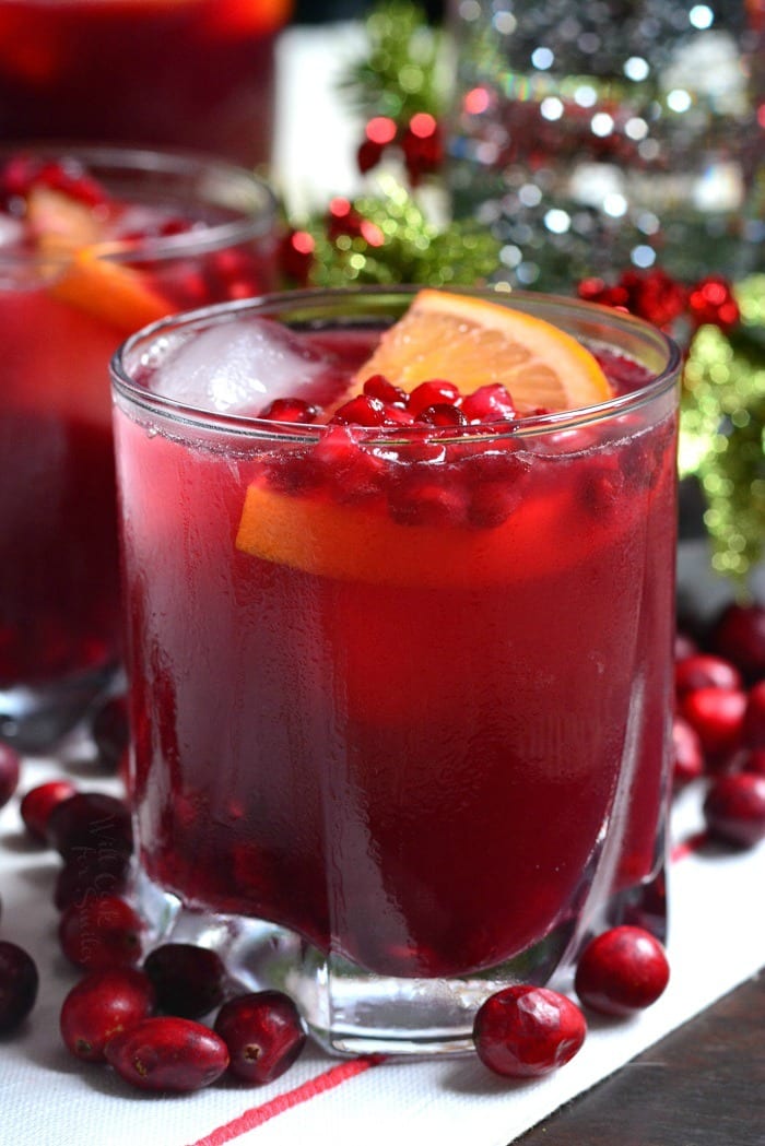 Christmas Punch in a glass with pomegranate and orange slice 
