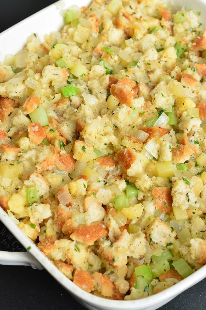 Homemade Stuffing Recipe. This stuffing is made with Italian bread, apples, celery, onions, and herbs. #sidedish #stuffing #bread #thanskgiving #dinner #sides