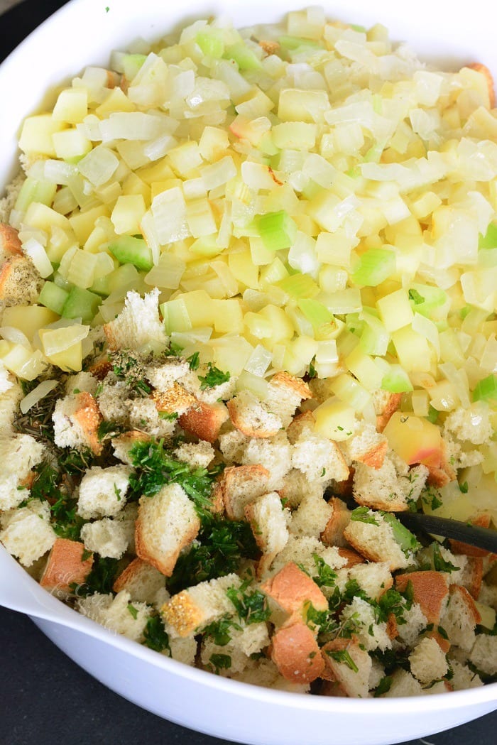 Simple Stuffing Recipe. This stuffing is made with Italian bread, apples, celery, onions, and herbs. #sidedish #stuffing #bread #thanskgiving #dinner #sides