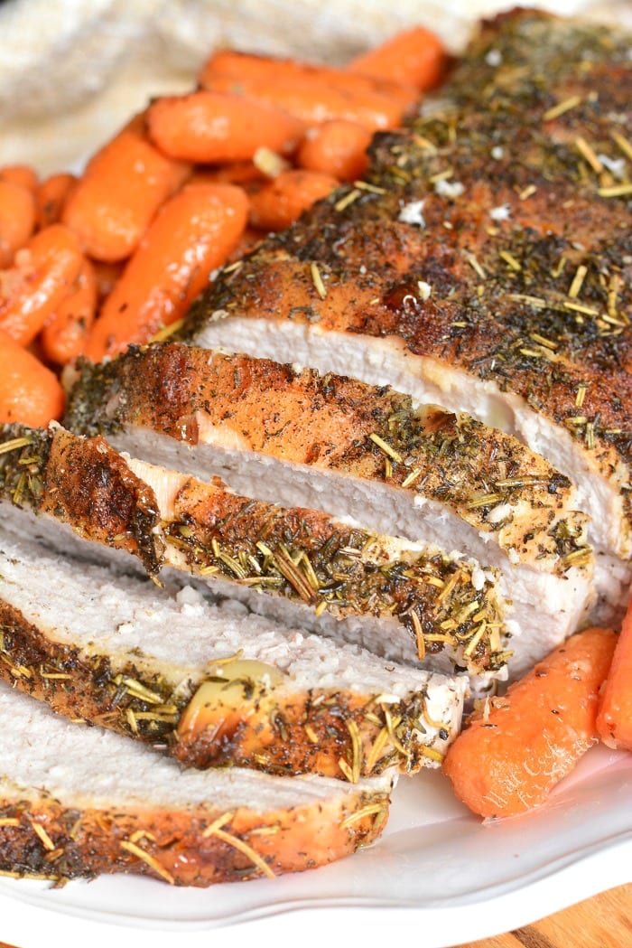 Garlic Pork Loin with carrots on a serving plate 