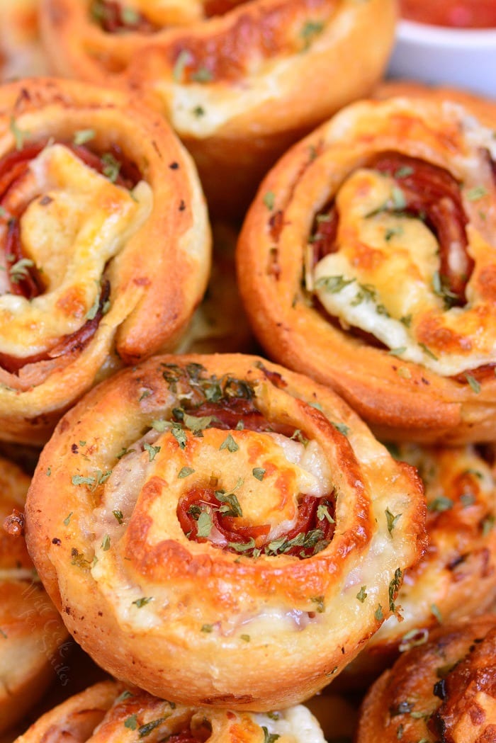 Italian Sub Pinwheels stacked on a plate 