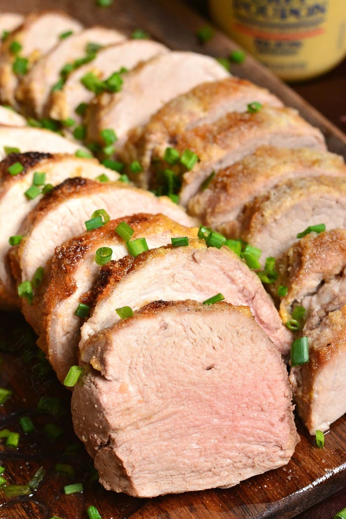 Pork Tenderloin. This pork tenderloin is rubbed with a flavorful mixture of Dijon mustard, brown sugar, and spices. It's prepared in the oven and ready in just 30 minutes. #pork #porktenderloin #dijon #maindish #dinner