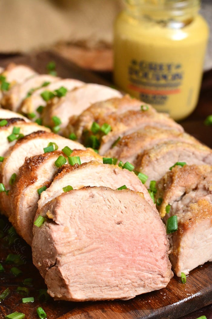 Roasted Pork Tenderloin. This pork tenderloin is rubbed with a flavorful mixture of Dijon mustard, brown sugar, and spices. It's prepared in the oven and ready in just 30 minutes. #pork #porktenderloin #dijon #maindish #dinner