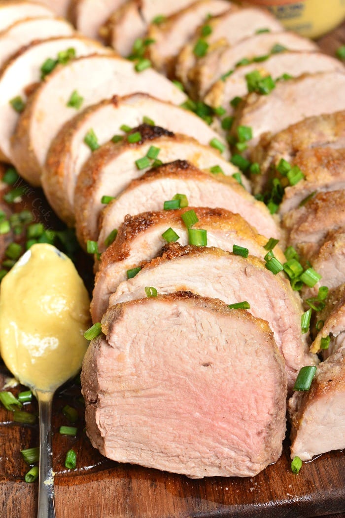 Pork Tenderloin. This pork tenderloin is rubbed with a flavorful mixture of Dijon mustard, brown sugar, and spices. It's prepared in the oven and ready in just 30 minutes. #pork #porktenderloin #dijon #maindish #dinner