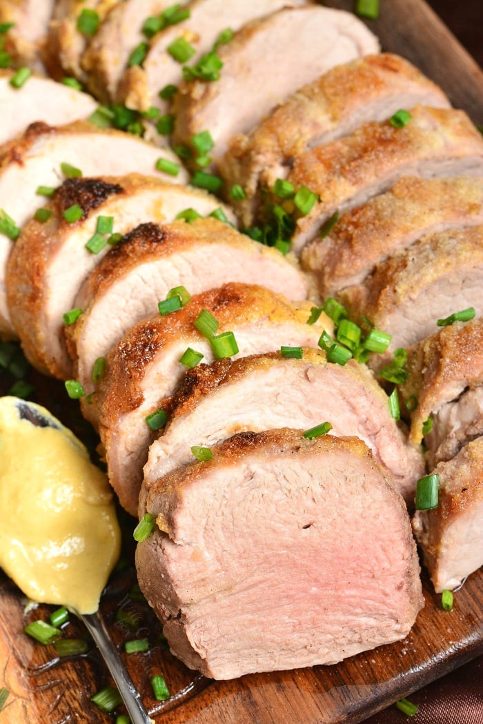 Brown Sugar Dijon Pork Tenderloin. This pork tenderloin is rubbed with a flavorful mixture of Dijon mustard, brown sugar, and spices. It's prepared in the oven and ready in just 30 minutes. #pork #porktenderloin #dijon #maindish #dinner