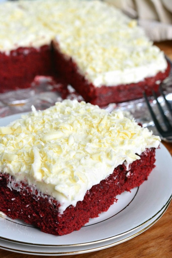 Red Velvet Brownies on a plate with rest of the pan in the background 