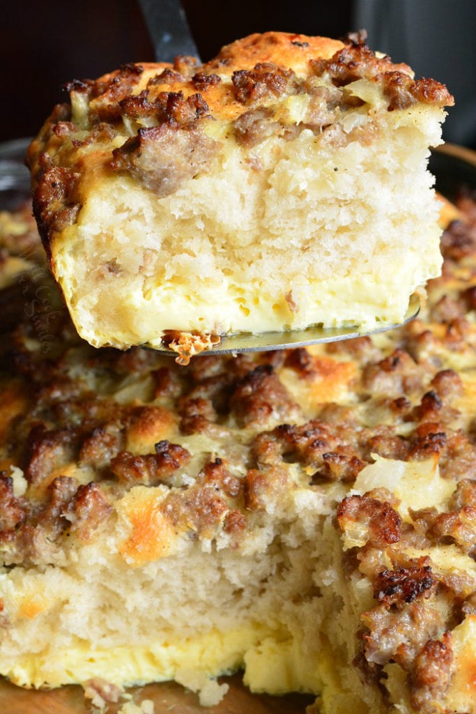 taking out a slice of breakfast casserole from the baking dish. 