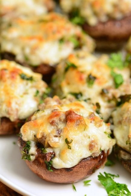 closeup of sausage stuffed mushroom on the white plate 