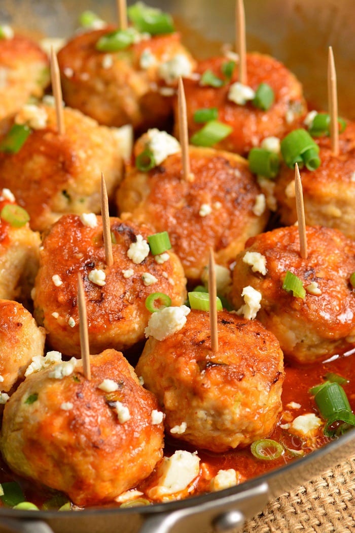 Buffalo Chicken Meatballs in a pan with toothpicks 