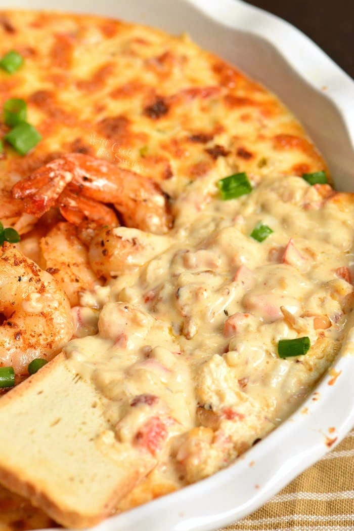 Shrimp Dip with bread dipping some out 