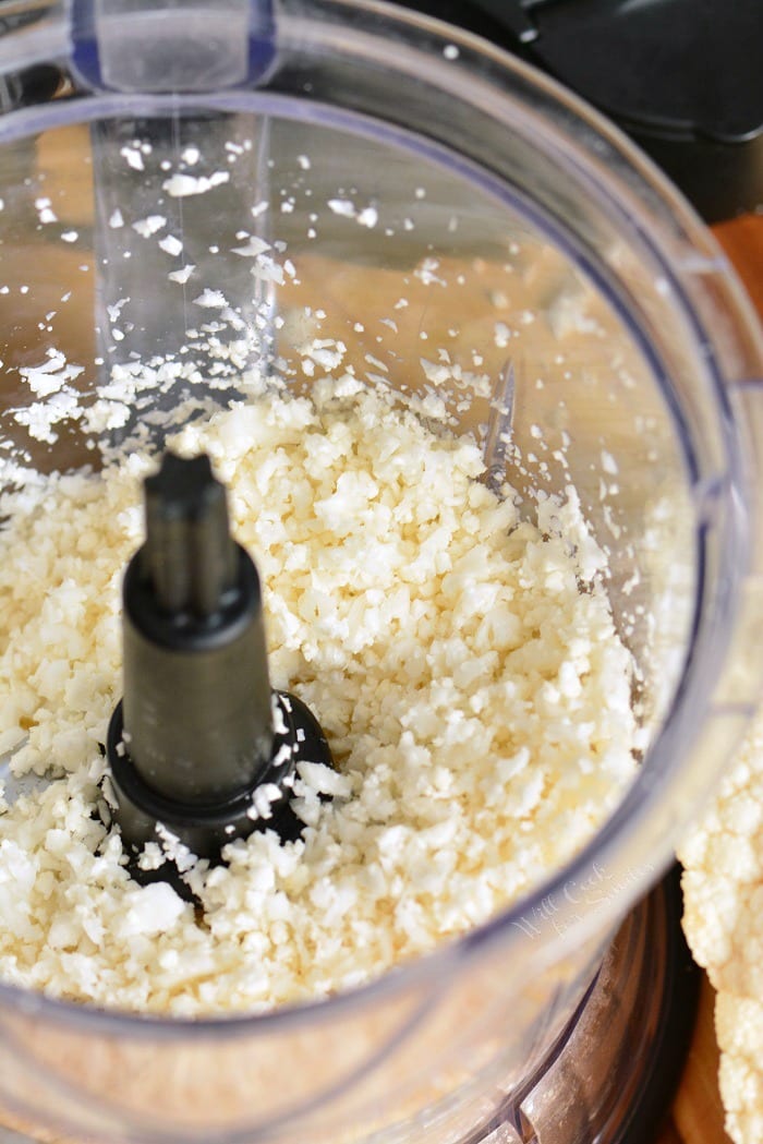 Cauliflower rice being shredded with a food processor 