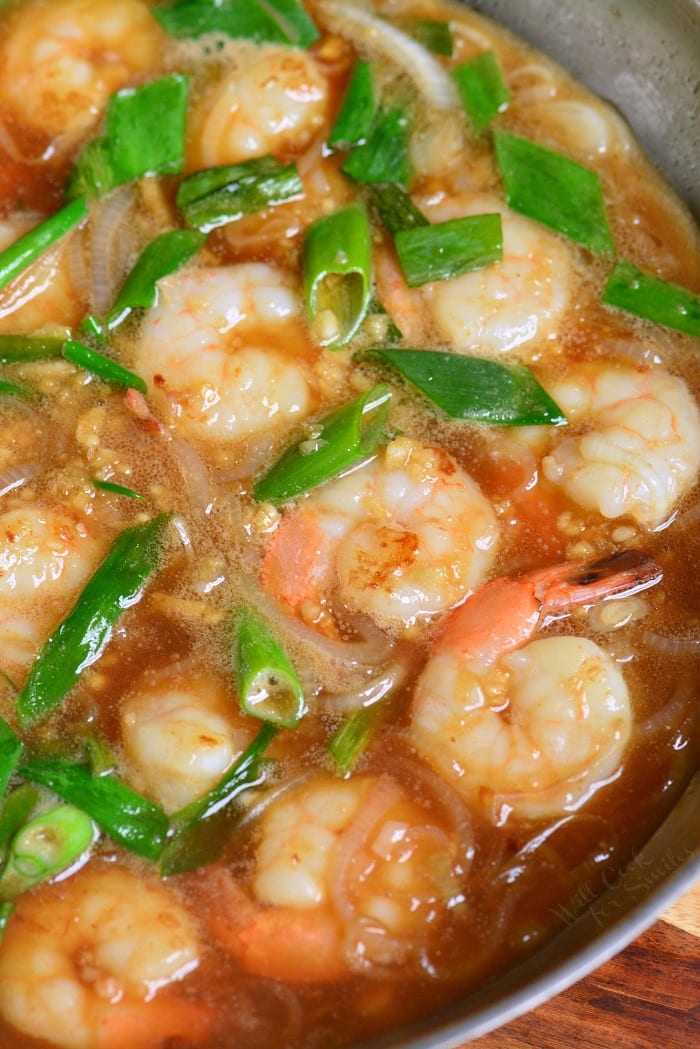 Garlic Shrimp Rice Bowl cooking in a pan 
