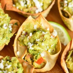 close up of Guacamole Cups on a cutting board.
