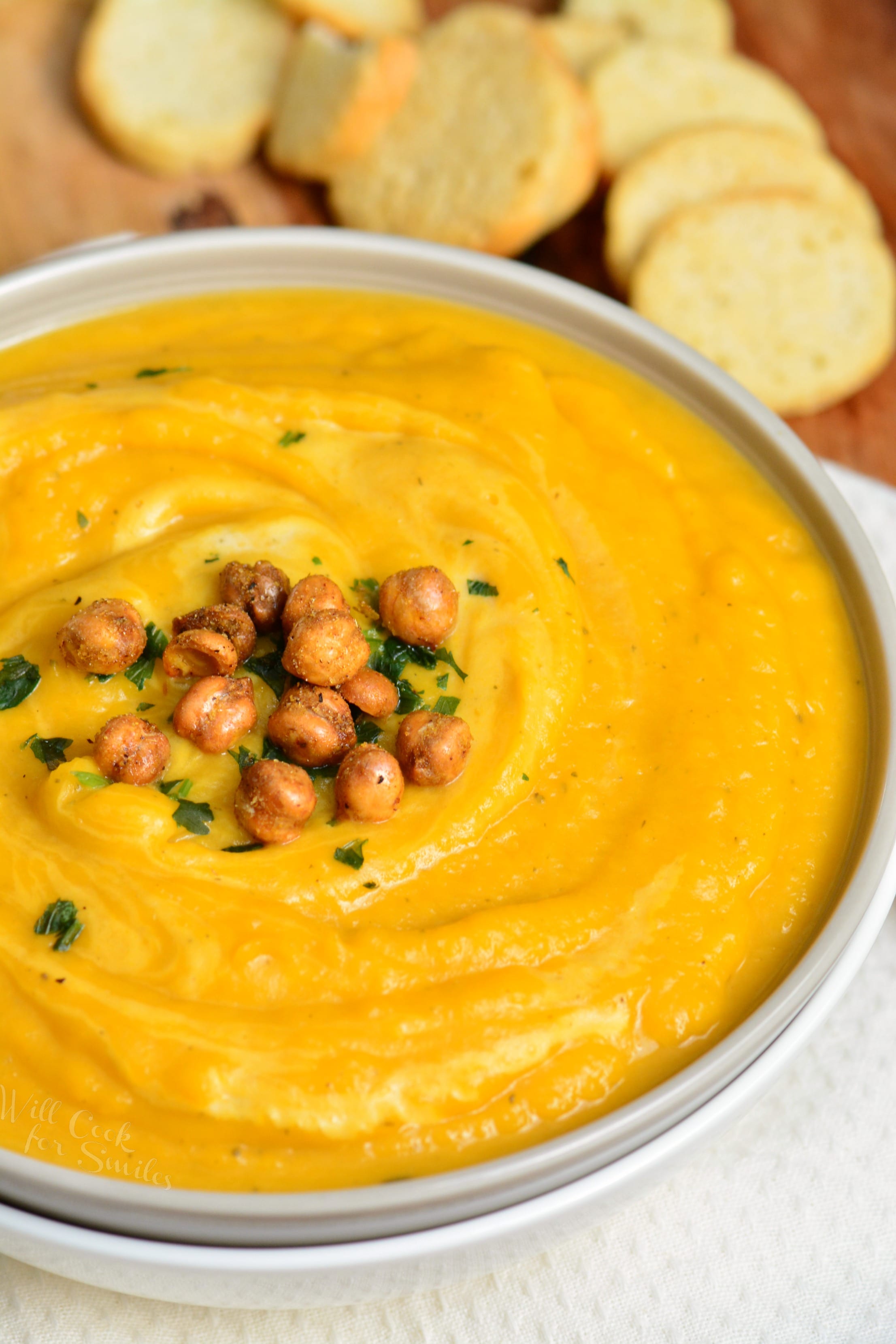 Butternut Squash Soup in a bowl with chickpeas on top 