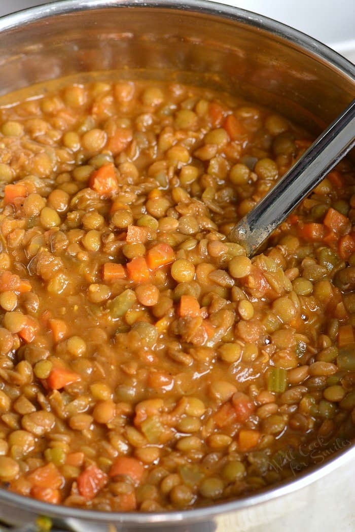 Lentil Soup in a pot with a metal spoon 