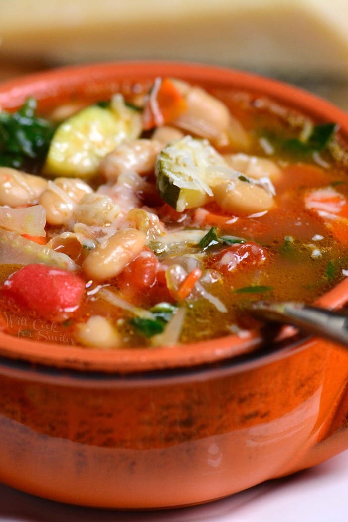 The Best Minestrone Soup in a bowl with a spoon 