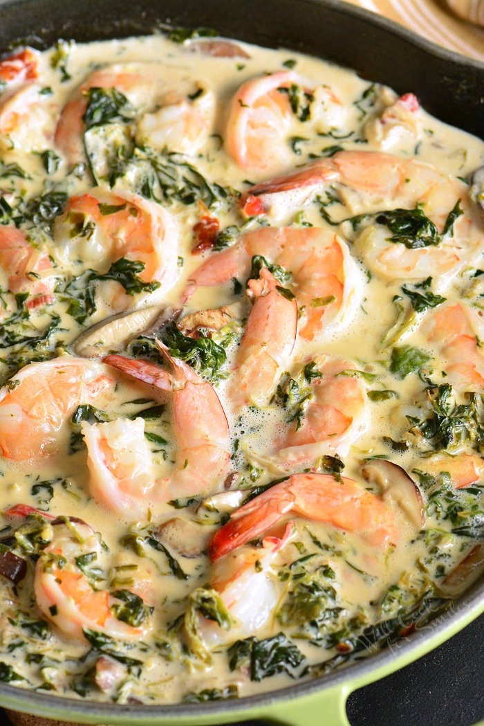 Shrimp Florentine is a fast and easy shrimp dinner recipe that features juicy shrimp cooked with spinach, mushrooms, shallots, sun-dried tomatoes, and white wine cream sauce. #shrimp #dinner #easydinner #30minute #seafood