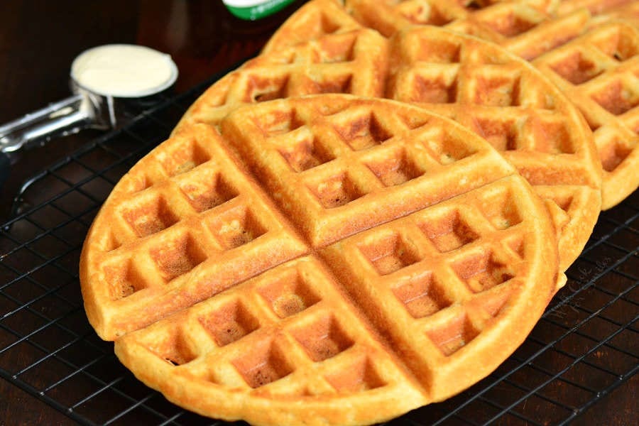 waffles lined up on a cooling rack.