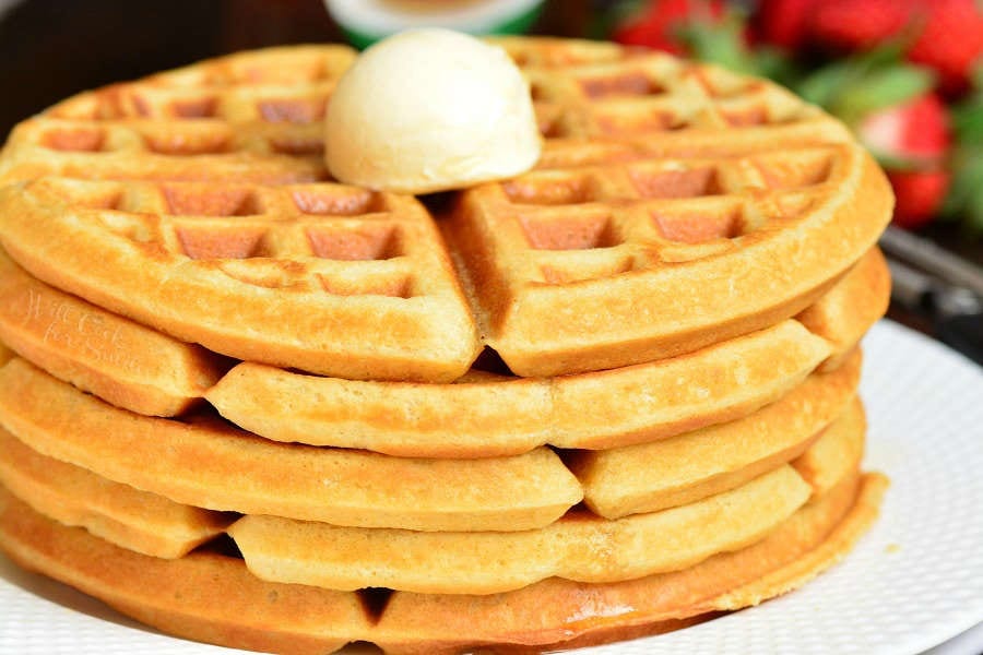 up close photo of waffles and butter on top.