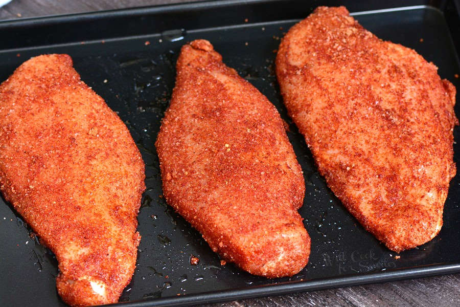 Baked Chicken with dry rub on baking sheet 