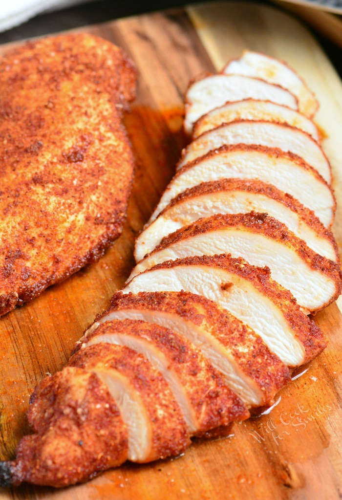 Baked Chicken sliced on cutting board 