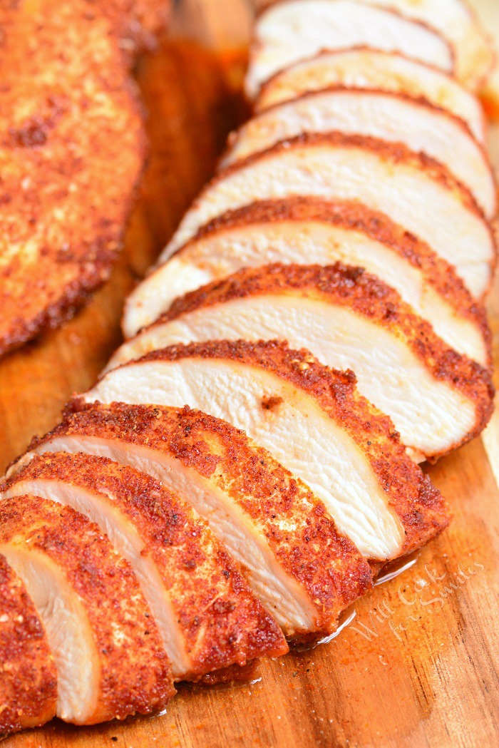 Baked Chicken sliced on cutting board 