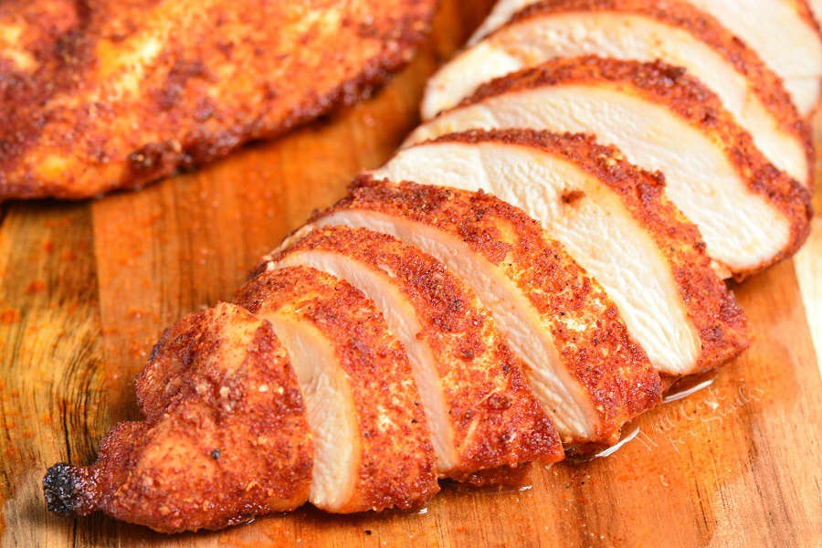 Baked Chicken sliced on cutting board 